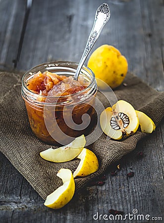 Homemade quince confiture in a glass jar Stock Photo