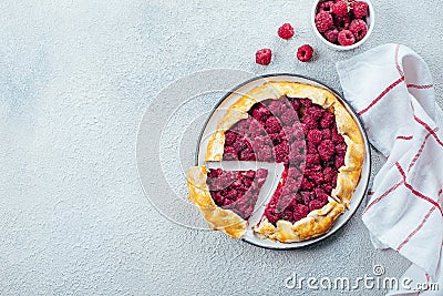 Homemade raspberry open pie gallete on a light concrete table background. Top view, copy space Stock Photo