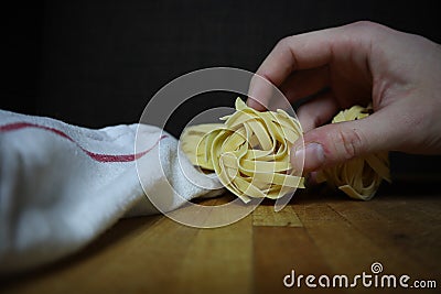 Homemade raw egg noodles on a background Stock Photo