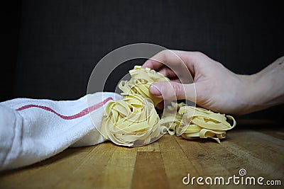 Homemade raw egg noodles on a background Stock Photo