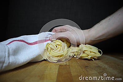 Homemade raw egg noodles on a background Stock Photo