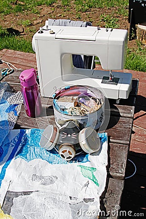 Homemade respirator, a box of sewing items, a sewing machine and plastic materials Stock Photo