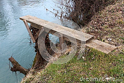 Homemade river diving board mounted on tree stump Stock Photo