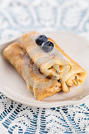 Homemade rolled pancakes with blueberry Stock Photo