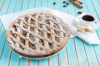 Homemade rustic apple tart pie on dish over wooden turquoise background Stock Photo