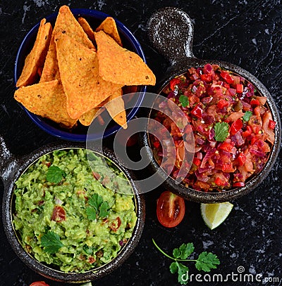 Homemade salsa and guacamole with corn chips Stock Photo