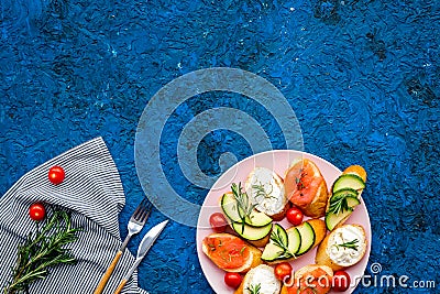 Homemade sandwiches with french baguette, salmon, cheese and vegetable on blue background top view mock-up Stock Photo