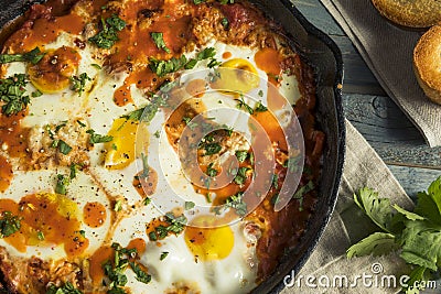 Homemade Saucy Shakshuka with Eggs Stock Photo