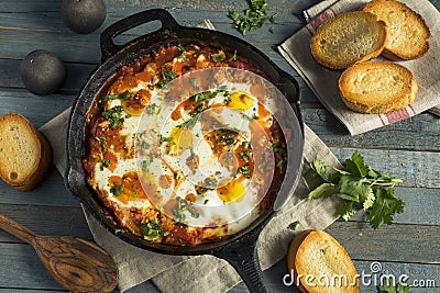 Homemade Saucy Shakshuka with Eggs Stock Photo