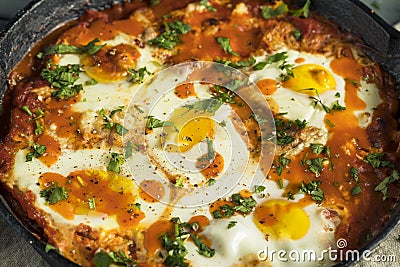 Homemade Saucy Shakshuka with Eggs Stock Photo