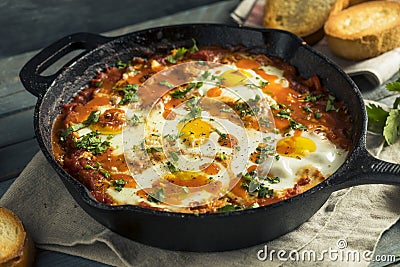 Homemade Saucy Shakshuka with Eggs Stock Photo