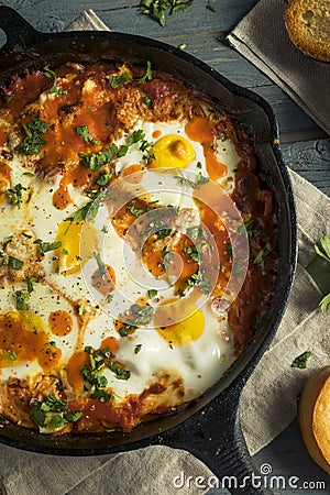 Homemade Saucy Shakshuka with Eggs Stock Photo