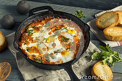 Homemade Saucy Shakshuka with Eggs Stock Photo