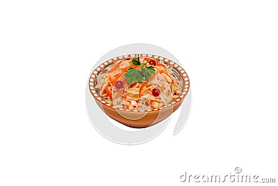 Homemade sauerkraut with carrots in a brown clay bowl isolated on a white background. Fermented food. Natural probiotic Stock Photo