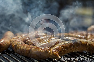 Homemade sausages on barbeque Stock Photo