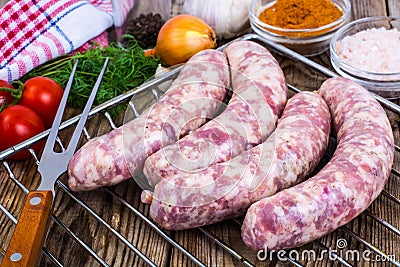 Homemade sausages in a natural shell with spices on grill Stock Photo