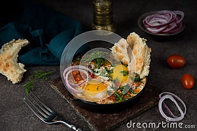 Homemade shakshuka with vegetables on a dark background Stock Photo