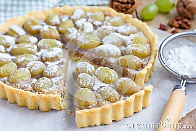 Homemade shortbread dough grape tart with walnut praline, horizontal Stock Photo