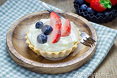 Homemade shortbread tartlets with custard cream, strawberry and blueberry Stock Photo