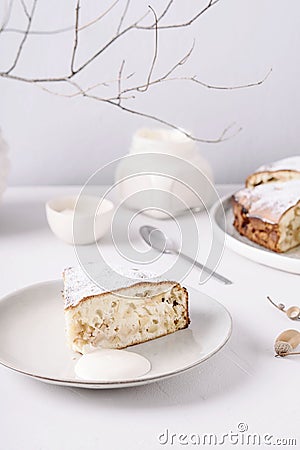 Homemade simple apple cake or pie sliced and sprinkled powdered sugar Stock Photo