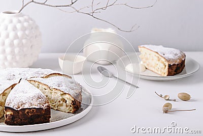 Homemade simple apple cake or pie sliced and sprinkled powdered sugar Stock Photo