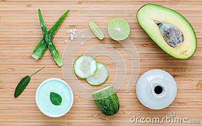 Homemade skin care and body scrub with natural ingredients avocado ,aloe vera ,lime,cucumber and honey set up on wooden Stock Photo