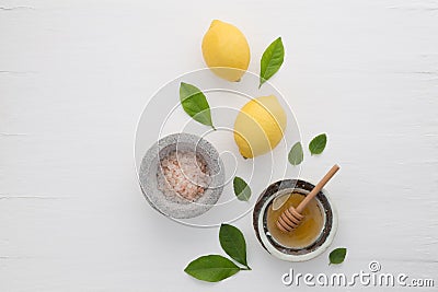 Homemade skincare concept, bath salt, lemon, honey dipper and mi Stock Photo