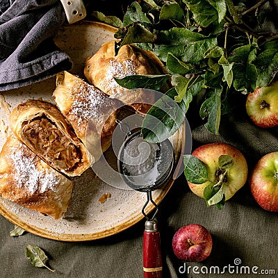 Homemade sliced traditional apple strudel pie and apples Stock Photo