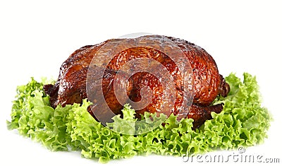 Homemade smoked whole chicken on leaf lettuce bed Stock Photo