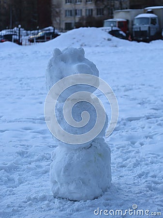 Homemade snow figure in the yard Stock Photo