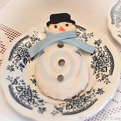 Snowman Cookie on a Pretty Plate Stock Photo