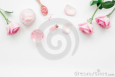 Homemade spa with rose cosmetic set, cream, salt and oil on white background top view mock-up Stock Photo