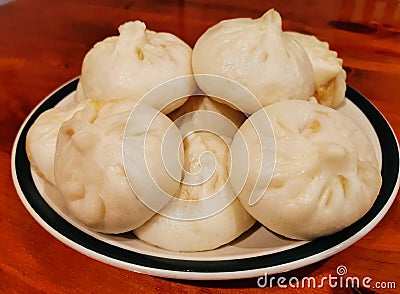 Homemade steamed stuffed buns on a plate Stock Photo