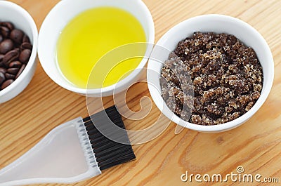 Homemade sugar, olive oil and ground coffee face and body scrub. Diy cosmetics. Stock Photo