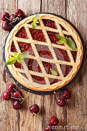 Homemade summer pastries cherry pie Crostata close-up. Vertical Stock Photo