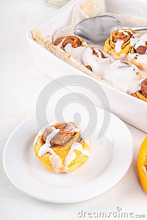 Homemade sweet autumn pumpkin cinnamon rolls Stock Photo