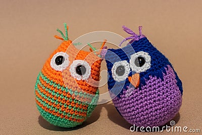 Homemade Three stuffed colorful toy owl. Stock Photo