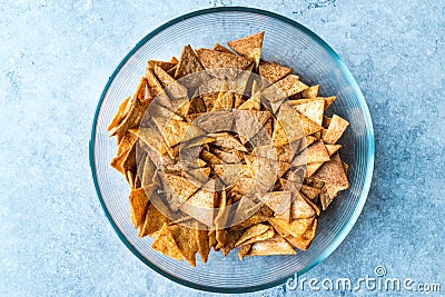 Homemade Tortilla Chips made with Flatbread in Glass Bowl and Baked in Oven. Stock Photo