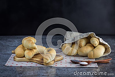 Homemade Traditional Czech pastry - white bread roll rohlik with salt and poppy seeds Stock Photo