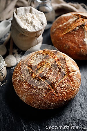 Homemade traditional sourdough loaf of bread on a black background Stock Photo