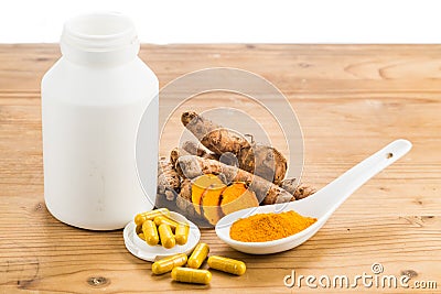 Homemade turmeric capsule from freshly grounded turmeric roots. Stock Photo