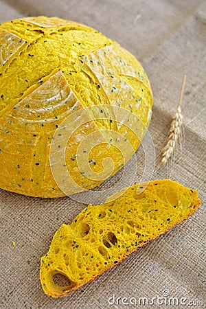 Homemade turmeric sourdough bread with flaxseeds Stock Photo