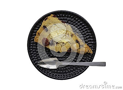 Homemade Vanilla Mixed Cream Cheese Granberry Scone served with spoon on black ceramic plate isolated on white background with Stock Photo