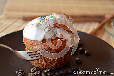 Homemade vanilla muffin with chocolate on a brown plate. Stock Photo