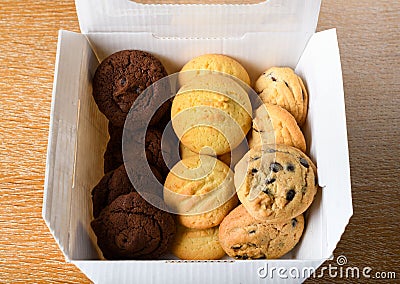 Homemade vanilla, orange, lemon chocolate chip cookies biscuits stack on a white plate Stock Photo