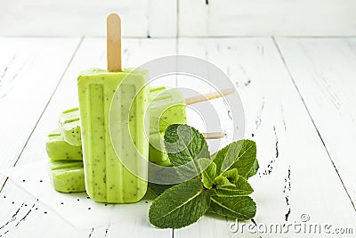 Homemade vegan green tea matcha mint coconut milk popsicles with chia seeds Stock Photo