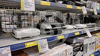 Homemade waffle makers on the supermarket shelves. Small household appliances for the kitchen. Editorial Stock Photo