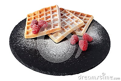 Homemade waffles with berries and sugar powder on black stone plate isolated. Belgian waffle with fruit raspberry on Stock Photo