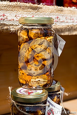 Homemade walnuts jam on wooden background in outdoor outside setting, during food festival. Natural feeling in direct sunlight, Editorial Stock Photo