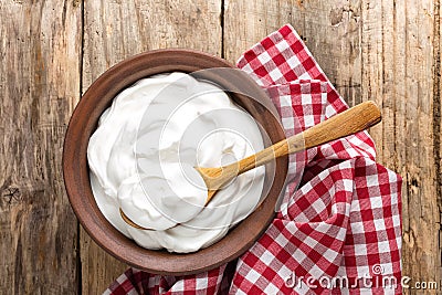 Homemade yogurt or sour cream in a rustic bowl Stock Photo